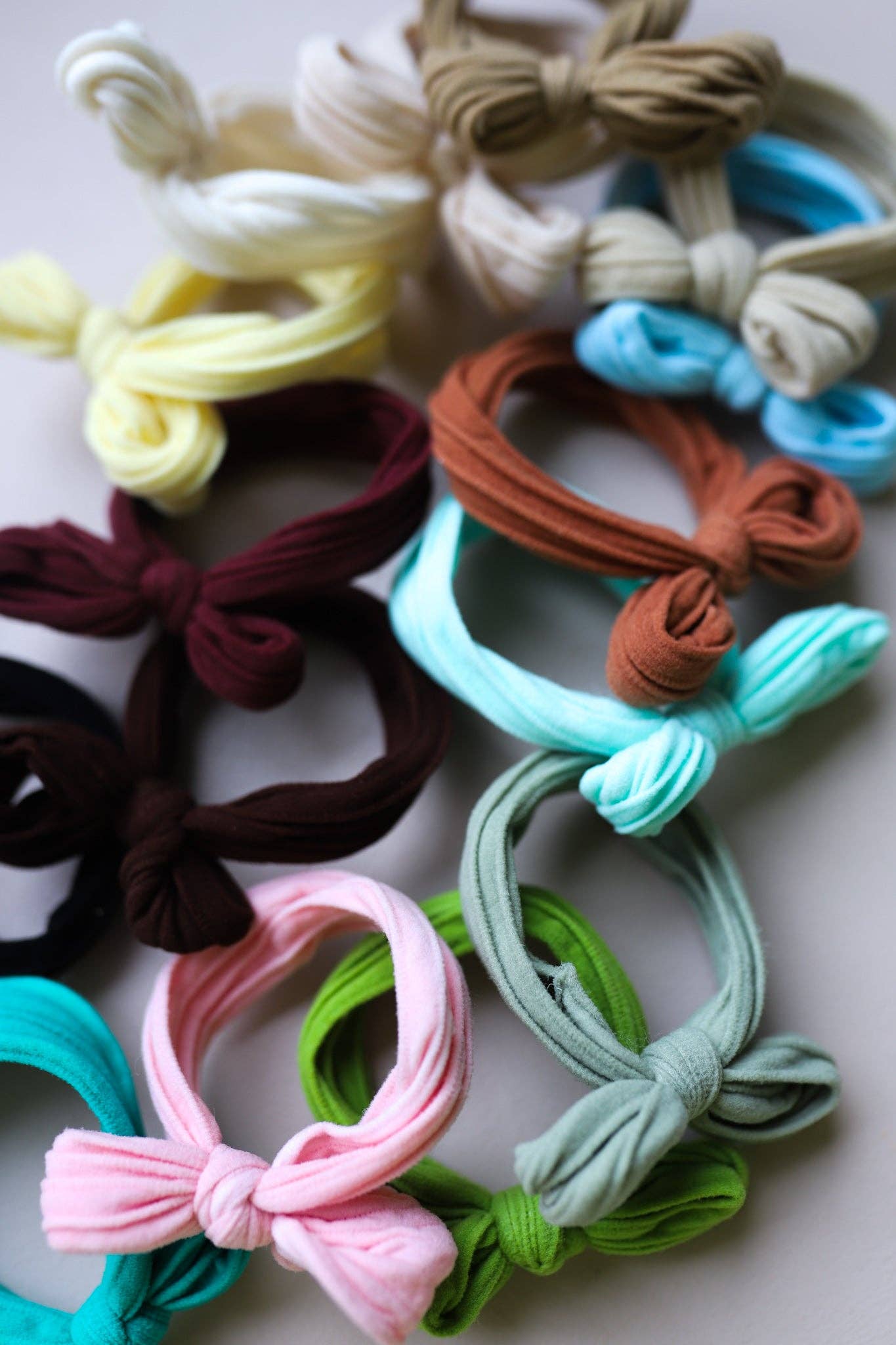 BOW SLICK BACK PONYTAILS (PACK OF 3): LIGHT PINK
