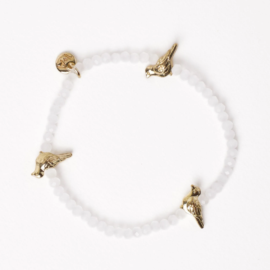 JANIE CRYSTAL STRETCH BRACELET WITH BRASS BIRD CHARMS WHITE